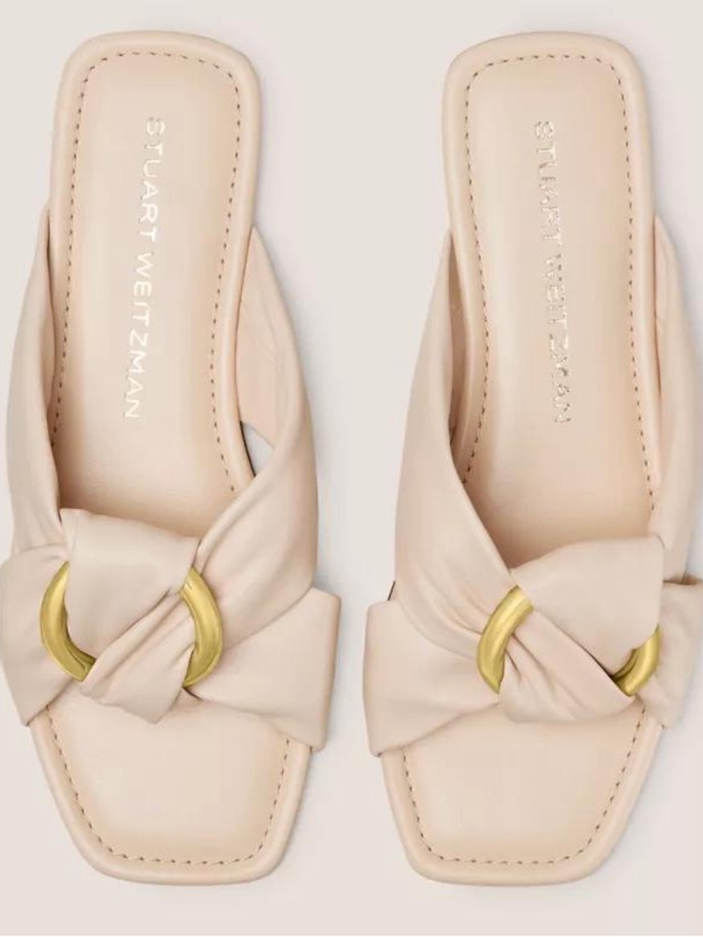 Stuart Weitzman Cream Knotted Slide Mules with Gold Ring